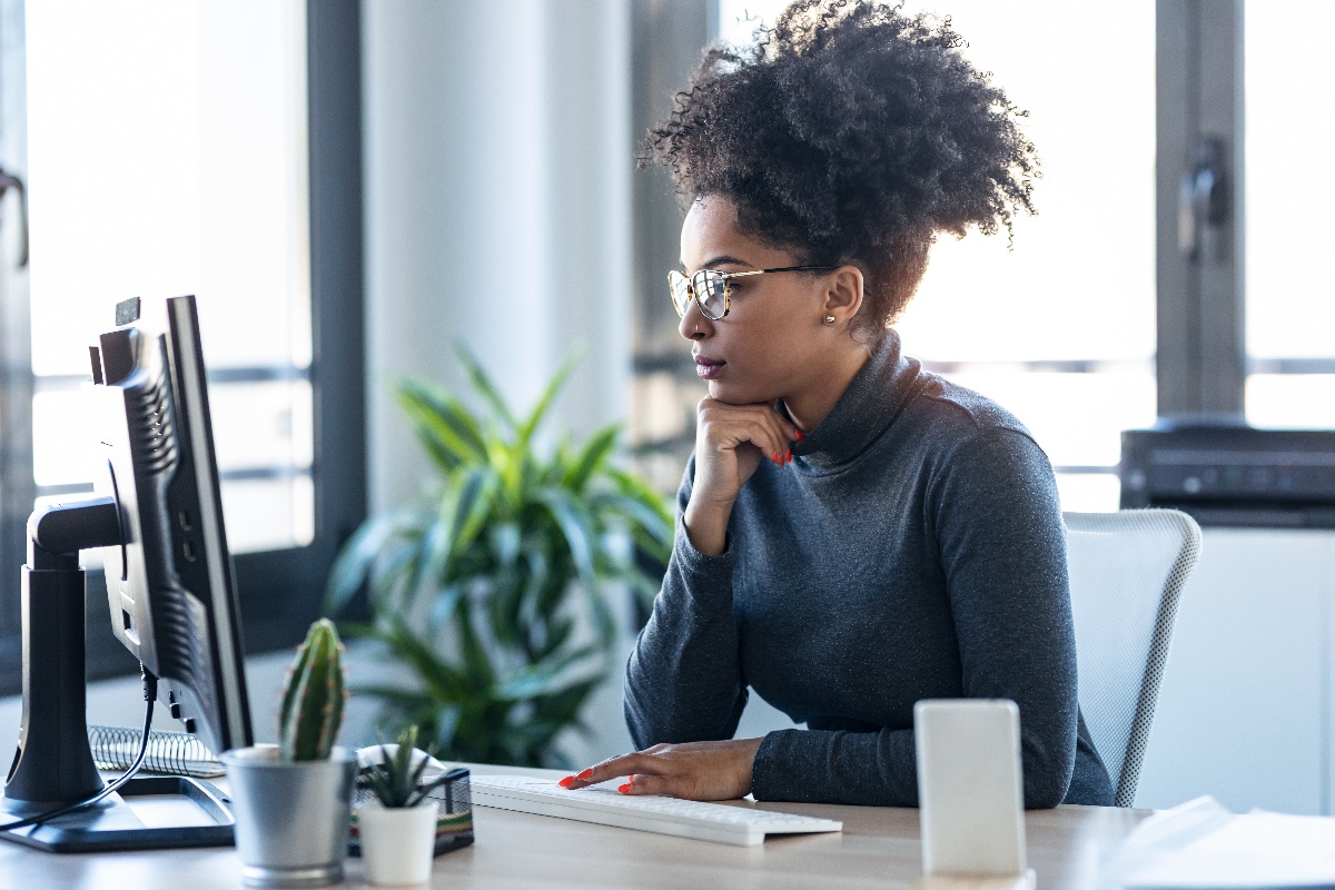Woman looking at property management software on computer